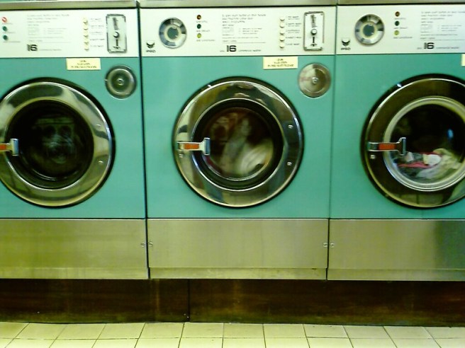 A bank of washing machines in a launderette